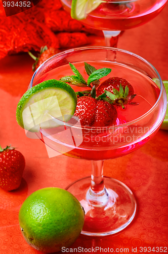 Image of wine with strawberries and lime