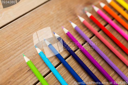 Image of close up of crayons or color pencils on wood