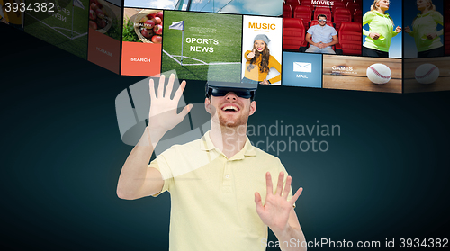 Image of happy man in virtual reality headset or 3d glasses