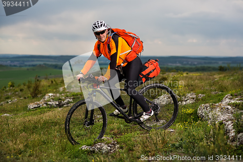 Image of Young man is riding bicycle outside. Healthy Lifestyle.