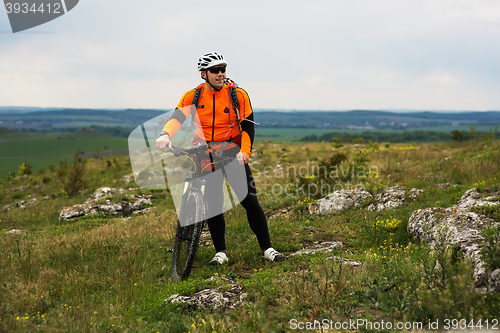 Image of Young man is riding bicycle outside. Healthy Lifestyle.