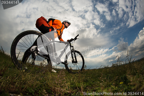 Image of Young man is riding bicycle outside. Healthy Lifestyle.