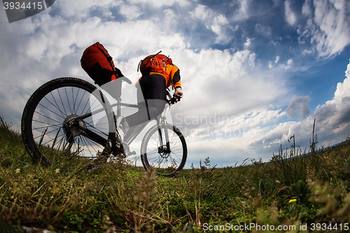 Image of Young man is riding bicycle outside. Healthy Lifestyle.