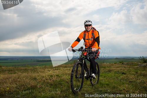 Image of Young man is riding bicycle outside. Healthy Lifestyle.