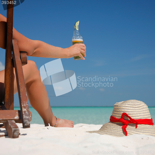 Image of Beer and Legs on the Beach