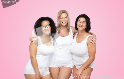 Image of group of happy plus size women in white underwear