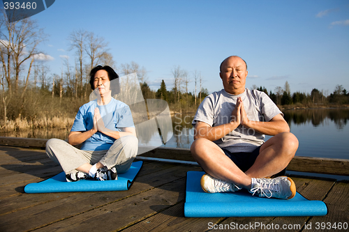 Image of Senior couple meditating