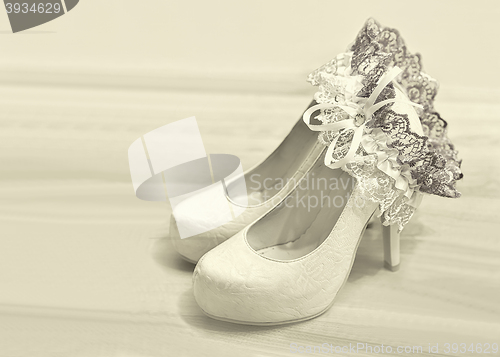 Image of Wedding shoes and garter of bride