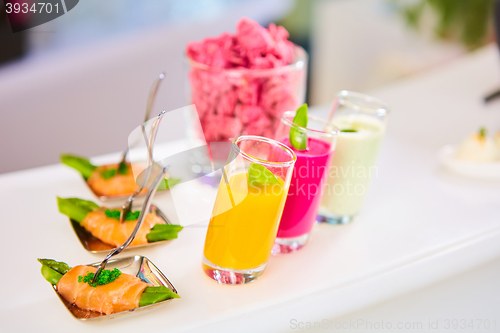 Image of Appetizer plate of sauteed asparagus wrapped in thin slices smoked salmon