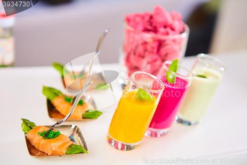 Image of Appetizer plate of sauteed asparagus wrapped in thin slices smoked salmon