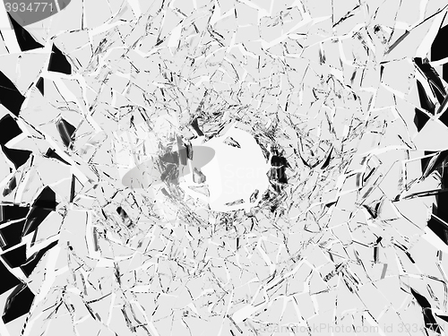 Image of Shattered white glass: sharp Pieces and hole 