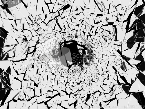 Image of Shattered white glass pattern and hole on black