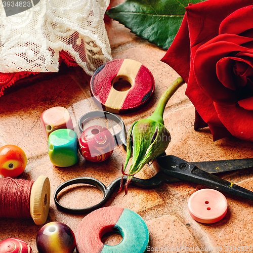 Image of Scissors,beads and thread