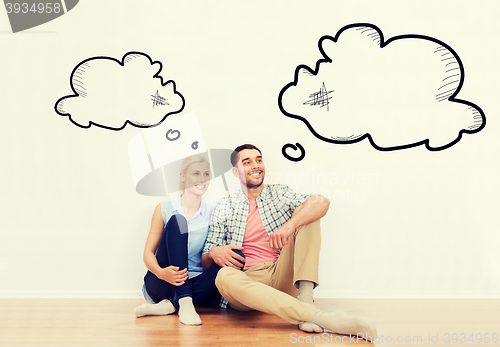Image of happy couple of man and woman moving to new home