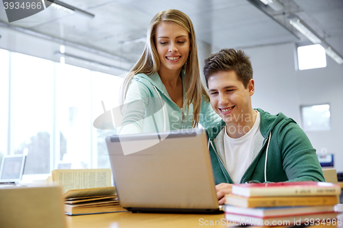 Image of high school students with laptop in classroom