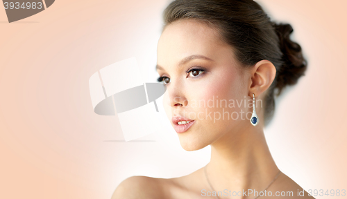 Image of close up of beautiful woman face with earring