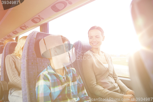 Image of happy family riding in travel bus