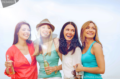 Image of girls with drinks on the beach