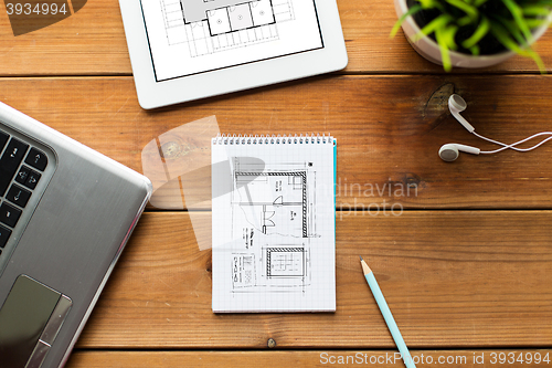 Image of close up of notebook, laptop and tablet pc on wood