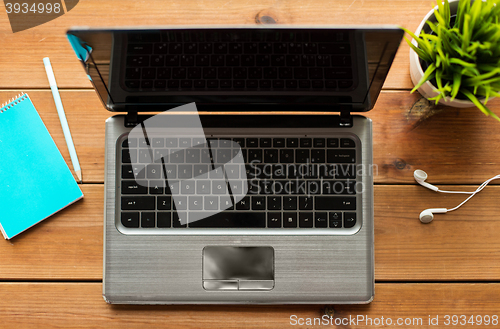 Image of close up of laptop computer on wooden table