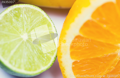 Image of close up of fresh juicy orange and lime