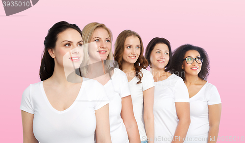 Image of group of happy different women in white t-shirts