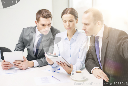 Image of business team with tablet pc having discussion