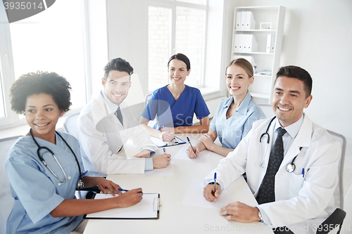 Image of group of happy doctors meeting at hospital office