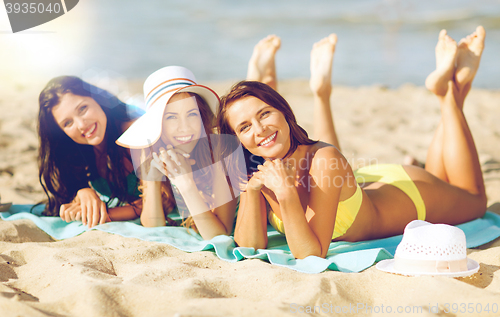 Image of girls sunbathing on the beach