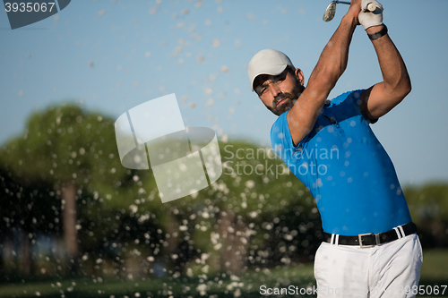 Image of pro golfer hitting a sand bunker shot