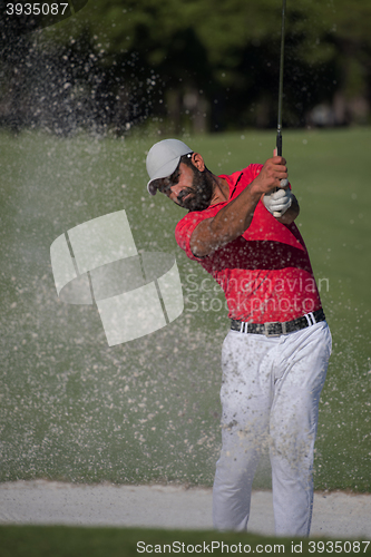 Image of golfer hitting a sand bunker shot