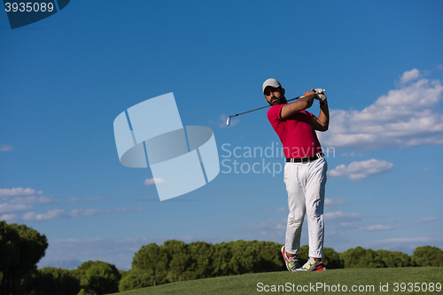 Image of golf player hitting long shot