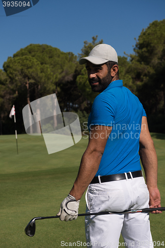 Image of golf player portrait from back