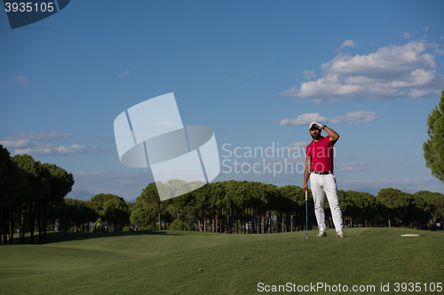 Image of handsome middle eastern golf player portrait at course