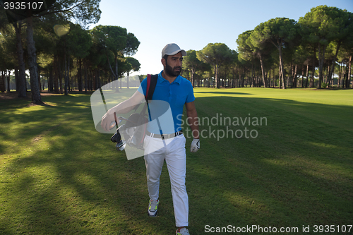 Image of golf player walking