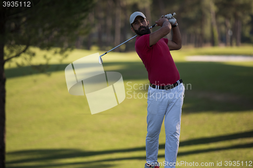 Image of golf player hitting long shot