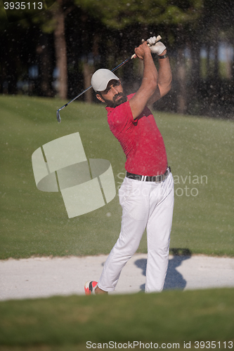 Image of golfer hitting a sand bunker shot