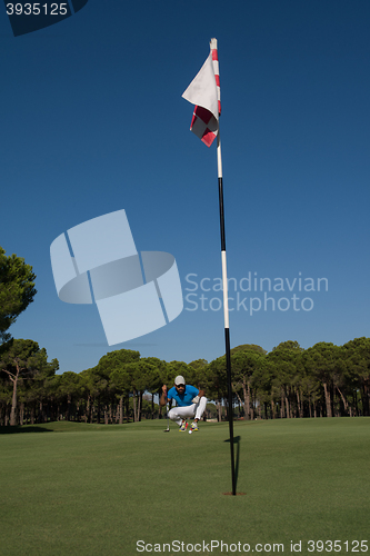 Image of golf player aiming perfect  shot