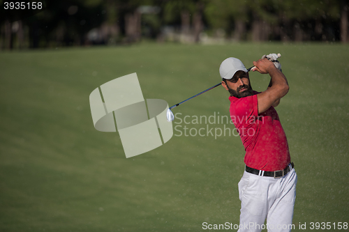 Image of golfer hitting a sand bunker shot