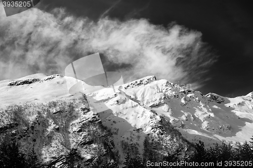 Image of Black and white view on off-piste ski slope at sun windy day