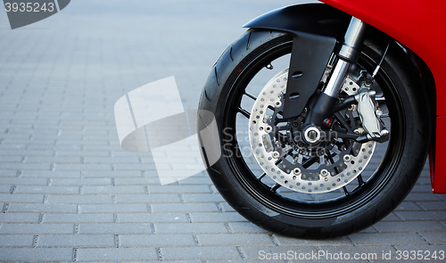 Image of Front motorcycle disk breaks and tire in close up