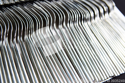 Image of close up of pile  fork on tray