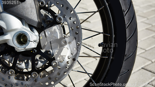 Image of Front motorcycle disk breaks and tire in close up