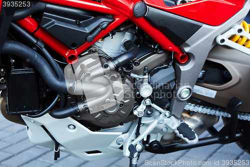 Image of detail of modern motorcycle engine.