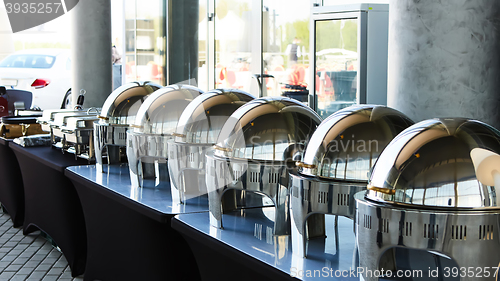 Image of Buffet Table with Row of Food Service Steam Pans