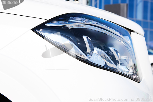 Image of Closeup headlights of luxury car.
