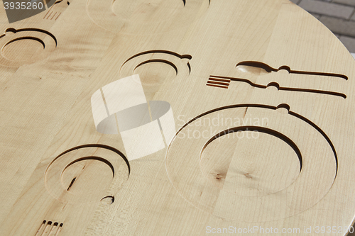 Image of Empty Plate, Knife and Fork on wooden background.