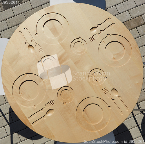 Image of Empty Plate, Knife and Fork on wooden background.