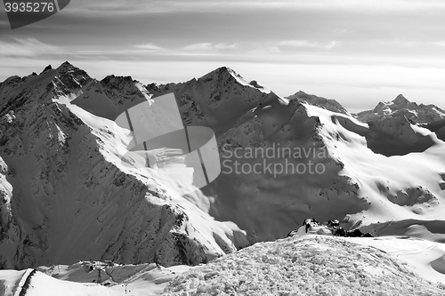 Image of Black and white Snowy off-piste slopes at evening