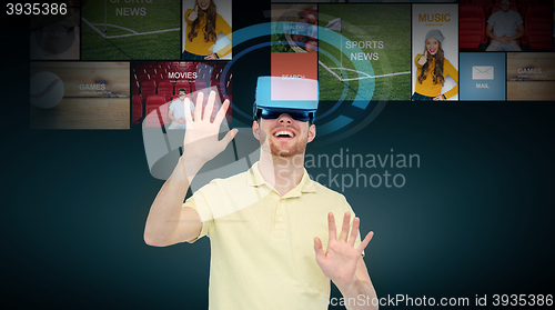 Image of happy man in virtual reality headset or 3d glasses